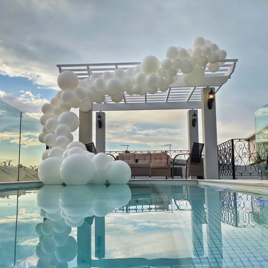 Wedding installation by a pool in sunset